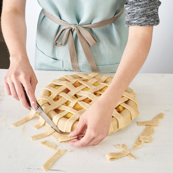 Trimming excess pie crust from lattice top crust