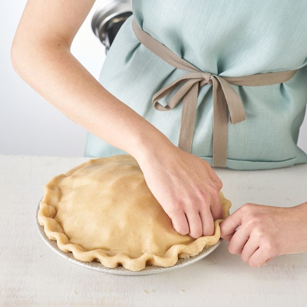 Fluting the edges of double crusted pie