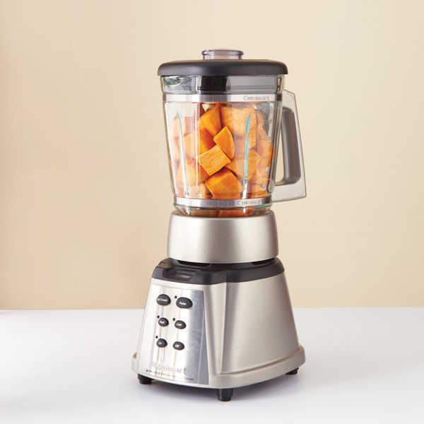 Cooked pumpkin cubes in blender