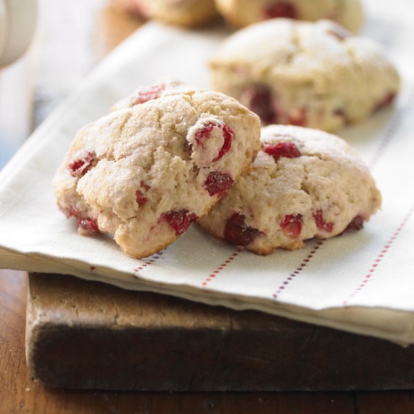 Cranberry-orange scones on a patterned red-and-white napkin