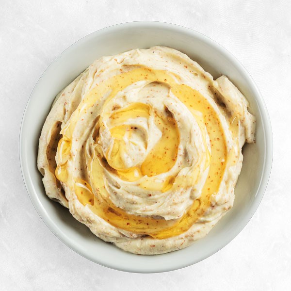 Bowl of creamy honey mustard spread