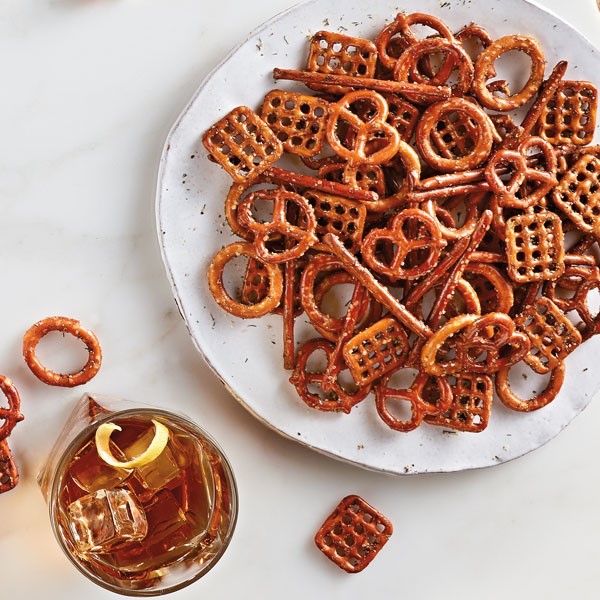 Seasoned party pretzels on white serving dish