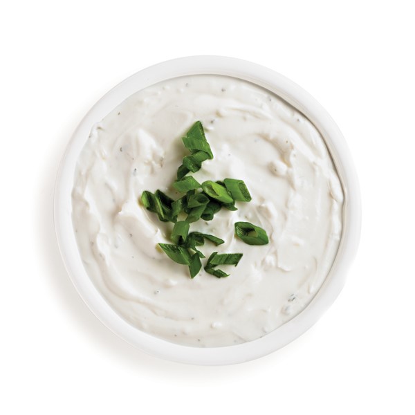 Side of horseradish sauce, garnished with fresh chives