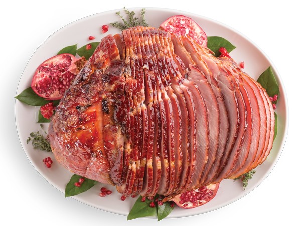 White platter of pomegranate-glazed ham