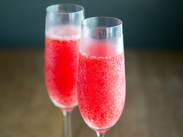Two glasses of red bubbly champagne cocktail