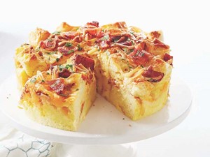 bacon and cheese strata on a cake stand